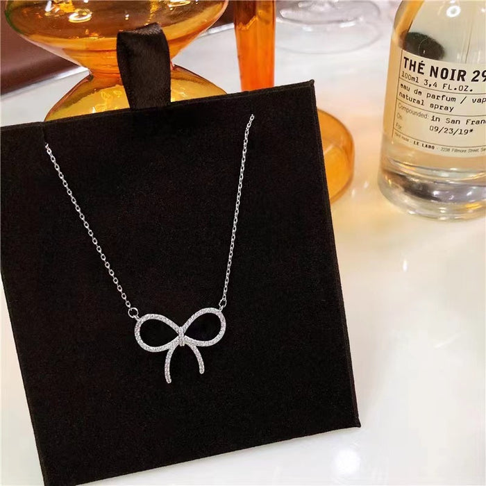 Wholesale Titanium steel necklace with high-end feel, full diamond bow pendant, light luxury, niche collarbone chain