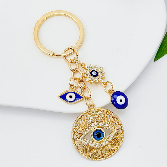Wholesale Diamond-encrusted blue eyes evil eye tassel keychain