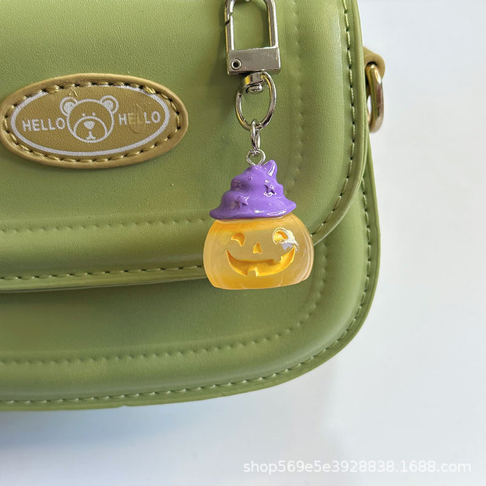 Wholesale Novelty  Pumpkin Pendant Keychain Glow In The Dark Resin Black Hat Design Bag And Earphone Case Charm Gift For Students And Couples