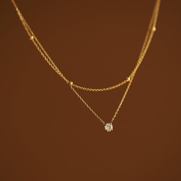 Wholesale Exquisite single diamond small double-layer necklace, gold bead collarbone chain, titanium steel electroplating