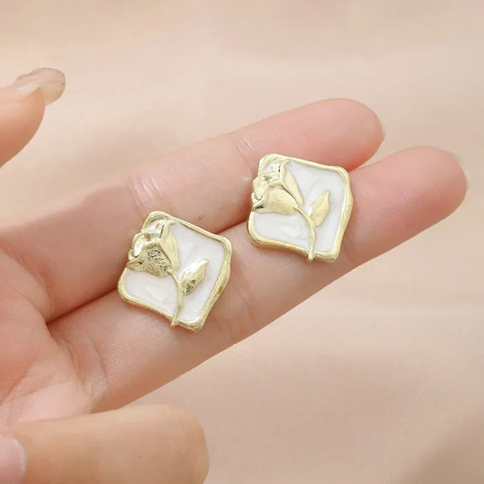 Wholesale Vintage rose silver needle earrings autumn and winter new item niche painting oil rose flower wholesale