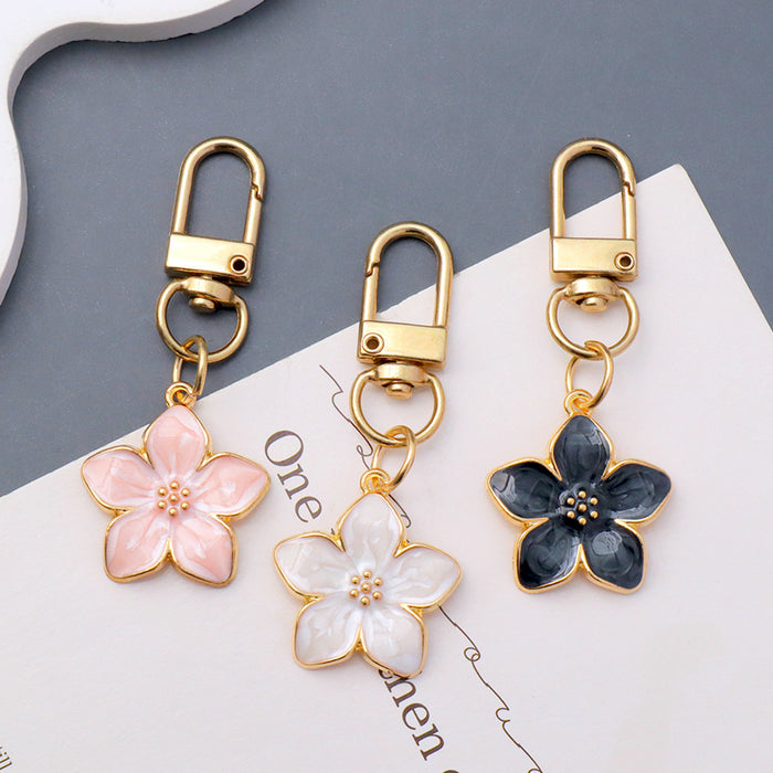 Wholesale Simple Dropping Oil Cherry Blossom Pendant Keychain Alloy Daisy Flower