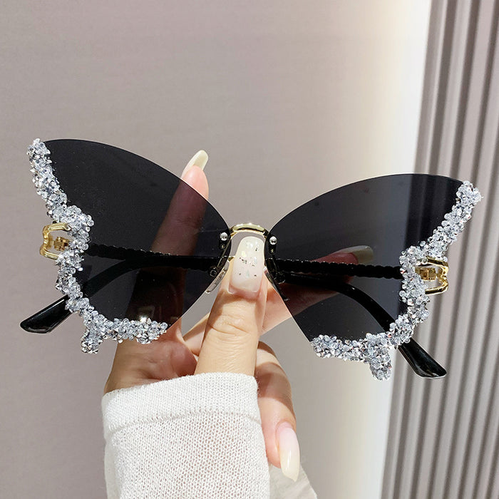 Wholesale Butterfly Shape Diamond Frameless PC Sunglasses JDC-SG-MNY001