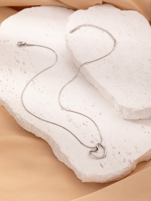 Wholesale Stainless Steel Clavicle Chain Necklace — Asymmetrical Design featuring a Bowknot  Rhinestone Accents  and Heart Pendant