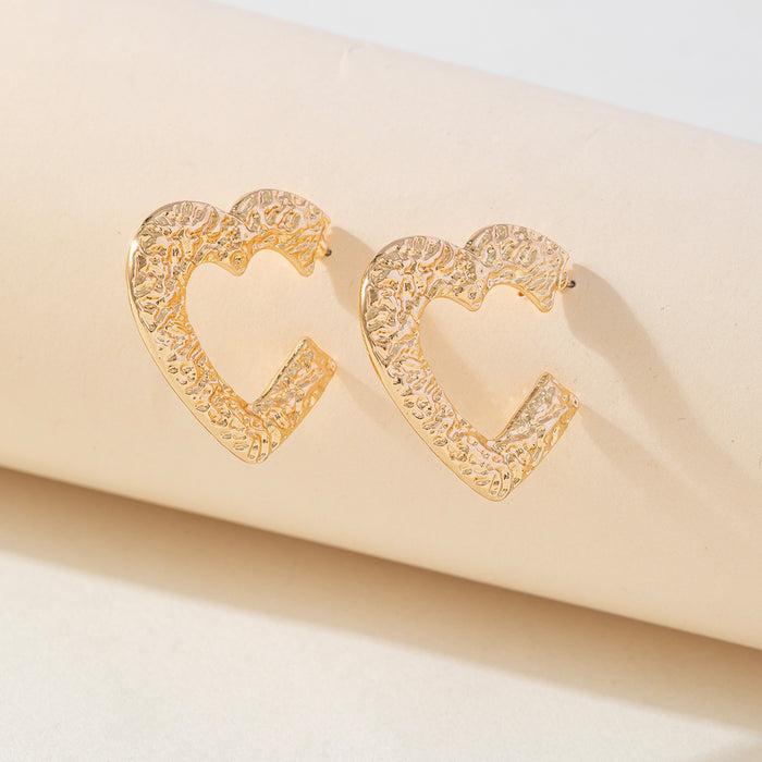 Wholesale Valentine' s Day gold plated embossed hammered texture heart  shaped hollow stud earrings