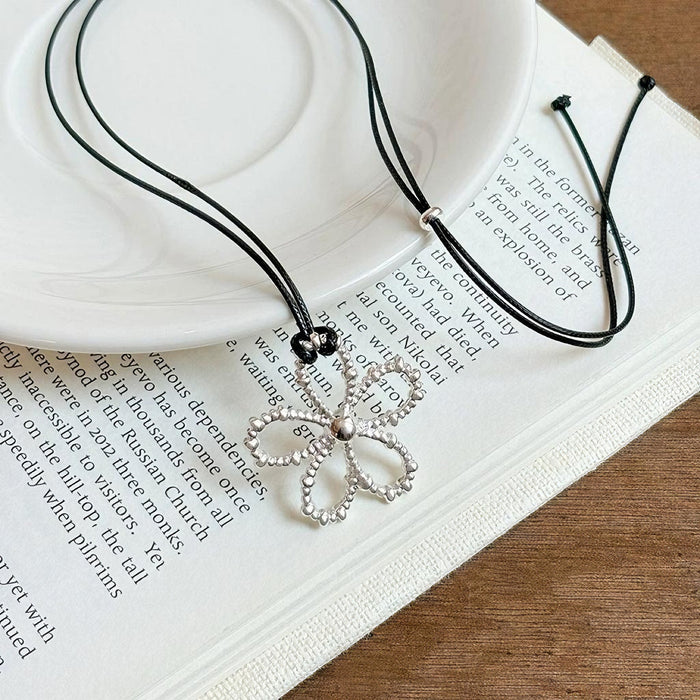 Wholesale Hollow flower necklace, simple black rope, adjustable neckchain, long and versatile collarbone chain