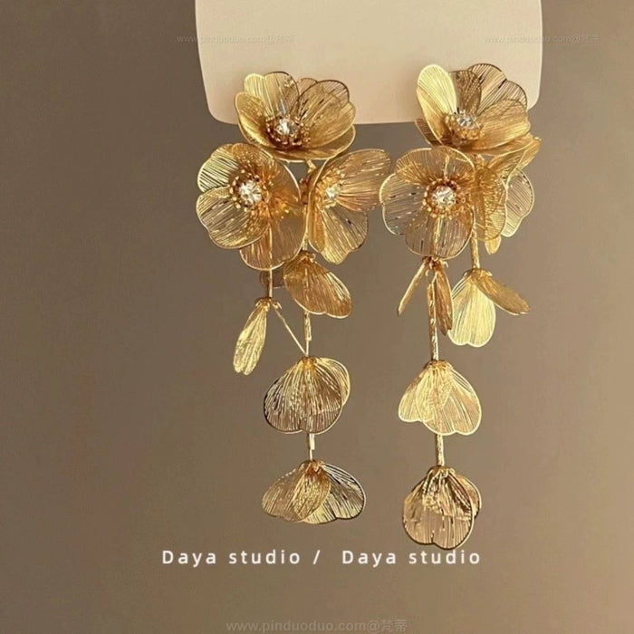 Wholesale Sparkling diamond dynamic hollow butterfly tassel earrings, light luxury temperament, high-end feeling, niche earrings, exaggerated earrings