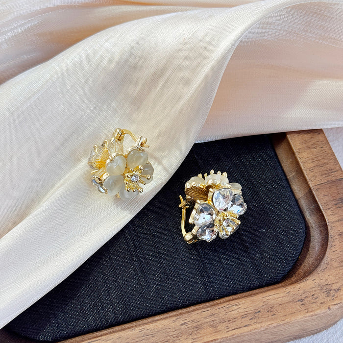 Wholesale Fashionable temperament, high-end earrings, light luxury, super fairy earrings, cat eye stones, double-sided flower ear buckles