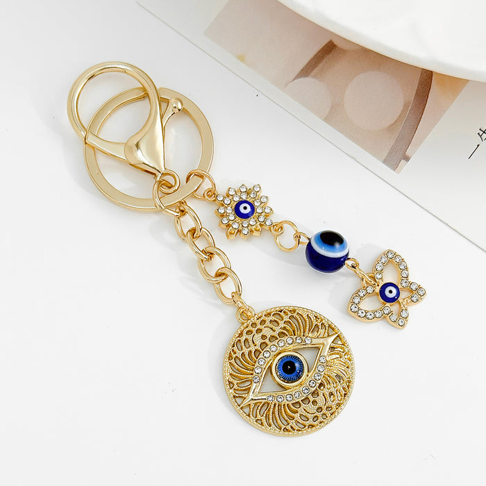 Wholesale Diamond-encrusted blue eyes evil eye tassel keychain