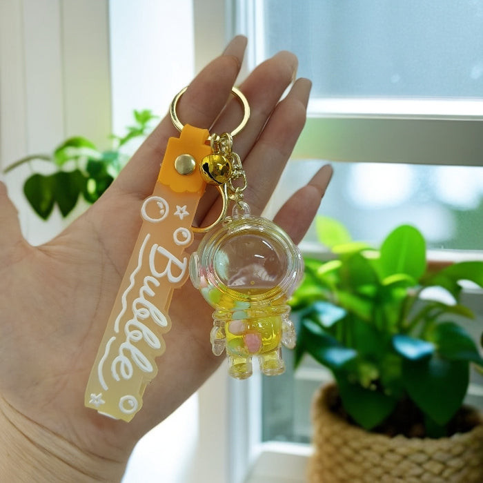 Wholesale Acrylic oil bottle candy Bean astronaut keychain