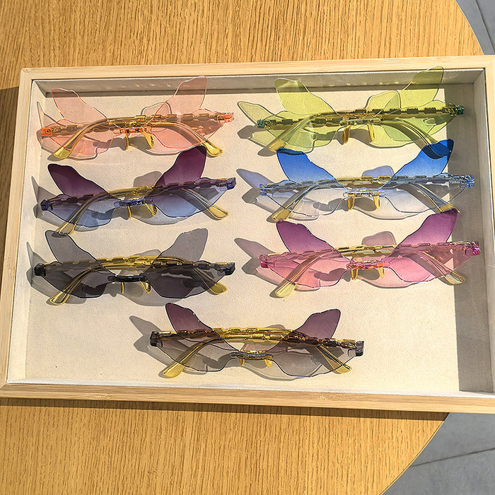 Wholesale Dragonfly shaped frameless sunglasses, personalized, penetrating, funny, decorative sunglasses