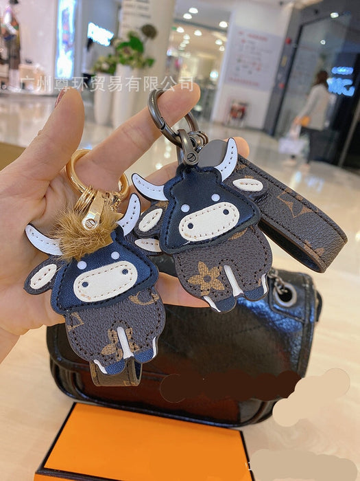 Wholesale Cartoon Classic Old Flower Cow Keychain Toy Bag Pendant Female Cute Male Couple Backpack Decorative Accessories Keychains JoyasDeChina Wholesale Jewelry JoyasDeChina Joyas De China
