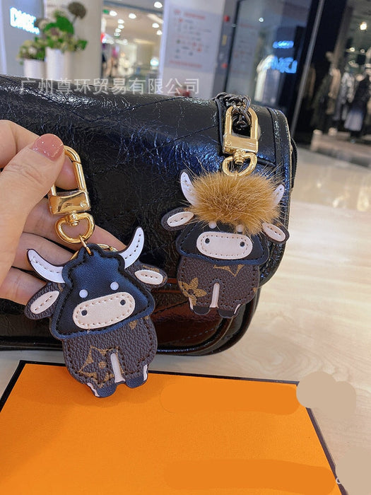 Wholesale Cartoon Classic Old Flower Cow Keychain Toy Bag Pendant Female Cute Male Couple Backpack Decorative Accessories Keychains JoyasDeChina Wholesale Jewelry JoyasDeChina Joyas De China