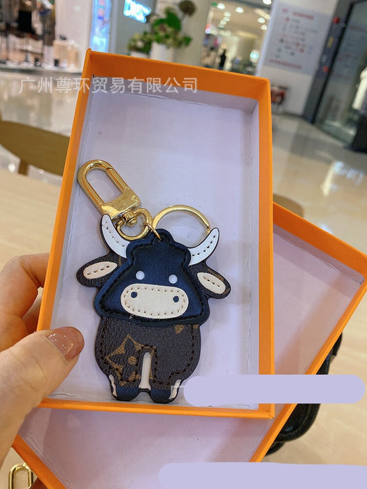 Wholesale Cartoon Classic Old Flower Cow Keychain Toy Bag Pendant Female Cute Male Couple Backpack Decorative Accessories Keychains JoyasDeChina Bullish A 0006688999 Wholesale Jewelry JoyasDeChina Joyas De China