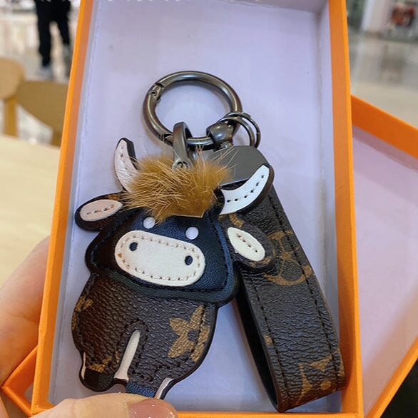 Wholesale Cartoon Classic Old Flower Cow Keychain Toy Bag Pendant Female Cute Male Couple Backpack Decorative Accessories Keychains JoyasDeChina Mink hair bullish B 0006688999 Wholesale Jewelry JoyasDeChina Joyas De China