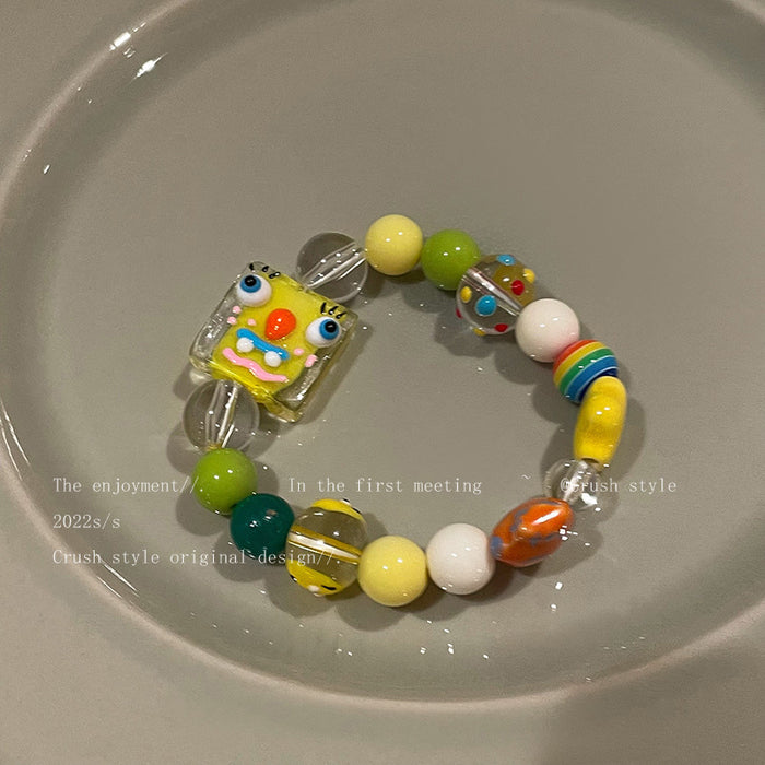 Artaje al por mayor Little Monster colorido brazalete de cerámica de cuentas JDC-BT-YQ002