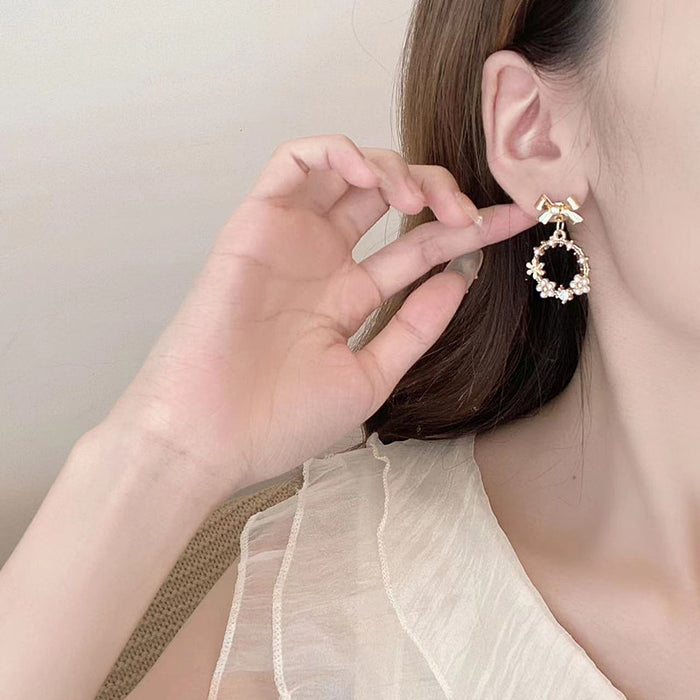 Wholesale Earrings Alloy Bow Pearl Cutout JDC-ES-AiMei020