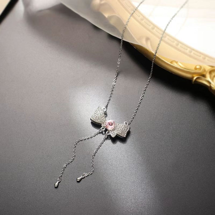 Collar de collar al por mayor Aleación Diamante Rosa Pen Pendientes de nudos de arco de la clavícula JDC-Ne-Yhai004