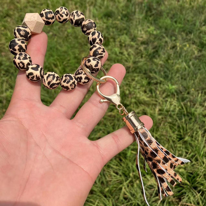 Keychain de bracelet à glands perlé à imprimé de tournesol en gros