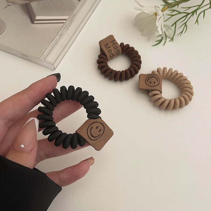 Wholesale earth color milk tea telephone wire hair ring rubber band JDC-HS-Qianq002