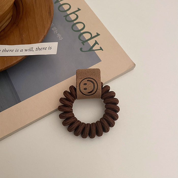Wholesale earth color milk tea telephone wire hair ring rubber band JDC-HS-Qianq002
