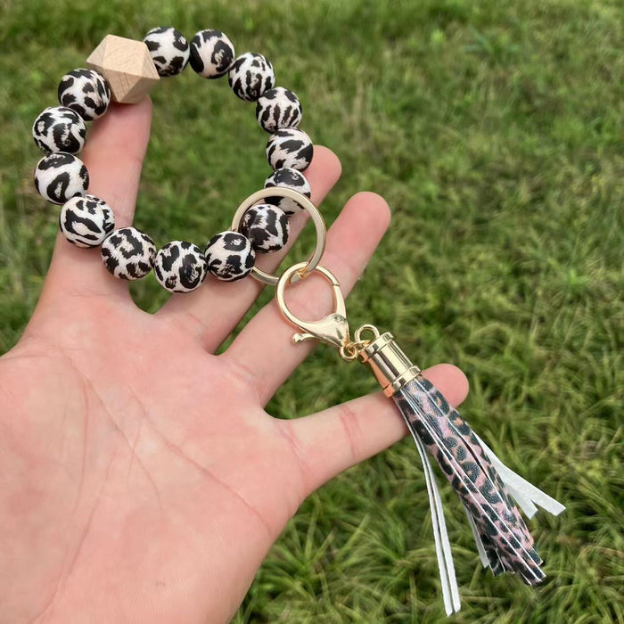 Keychain de bracelet à glands perlé à imprimé de tournesol en gros