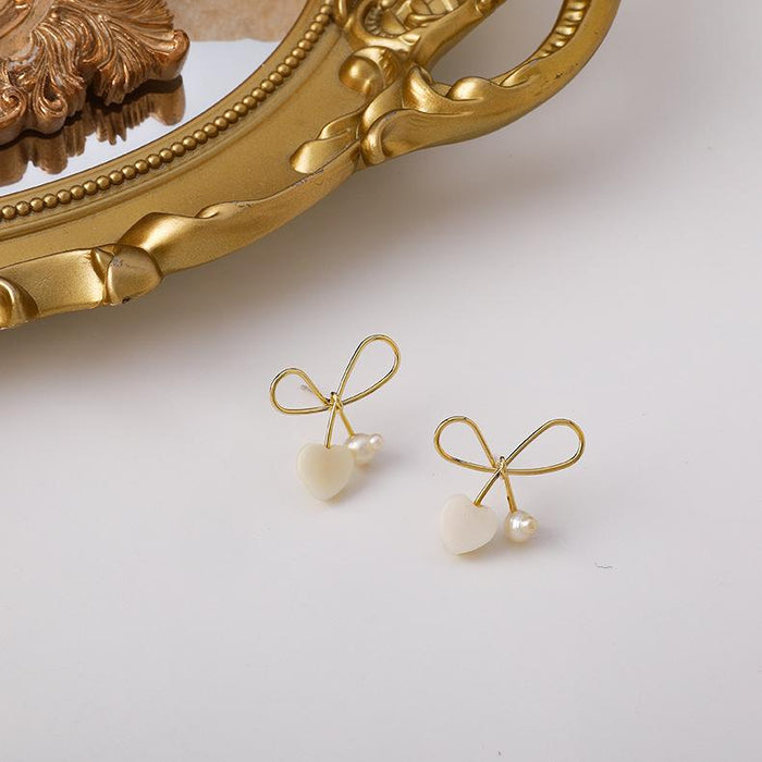 Wholesale Earrings gold Bow love pearls Alloy JDC-ES-W271 Earrings JoyasDeChina Main drawing Wholesale Jewelry JoyasDeChina Joyas De China