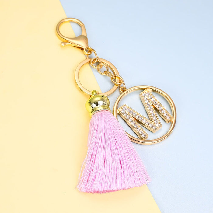 Wholesale pink tassel gold diamond-encrusted letter alloy key chain MOQ≥10 JDC-KC-yongz004 Keychains 永泽 Wholesale Jewelry JoyasDeChina Joyas De China