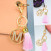 Wholesale pink tassel gold diamond-encrusted letter alloy key chain MOQ≥10 JDC-KC-yongz004 Keychains 永泽 Wholesale Jewelry JoyasDeChina Joyas De China